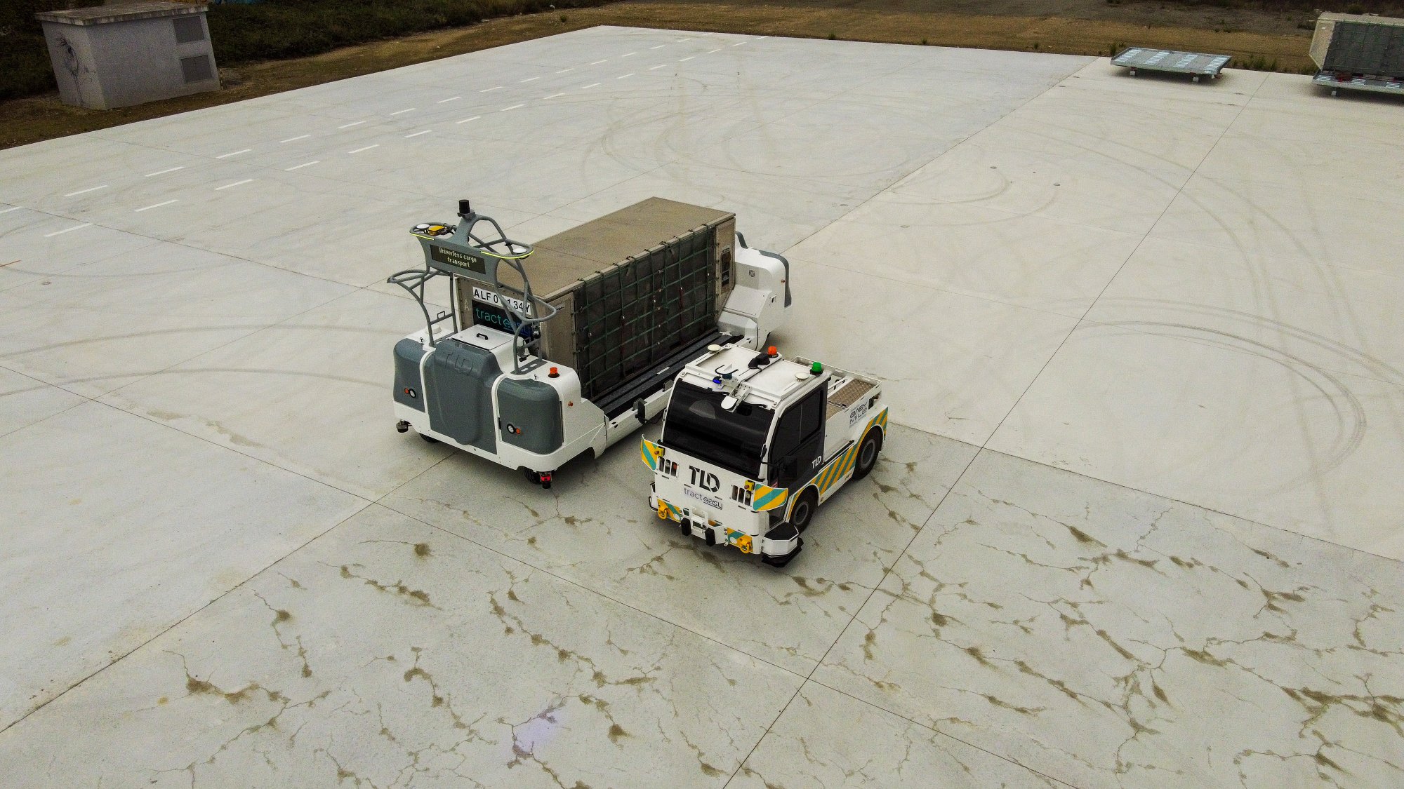 Aerial view of autonomous vehicles on tarmac